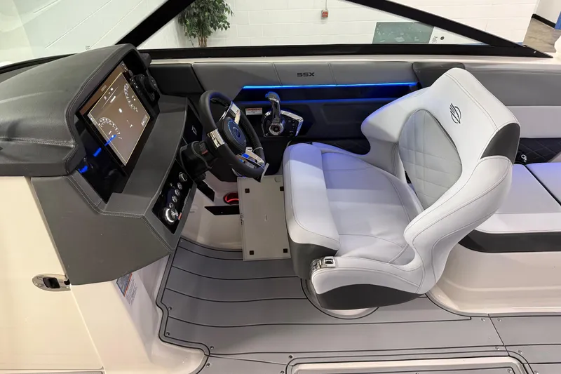 Slide: The Image of 2026 Chaparral 30 SSX boat interior with modern dashboard and luxurious seating. - 7