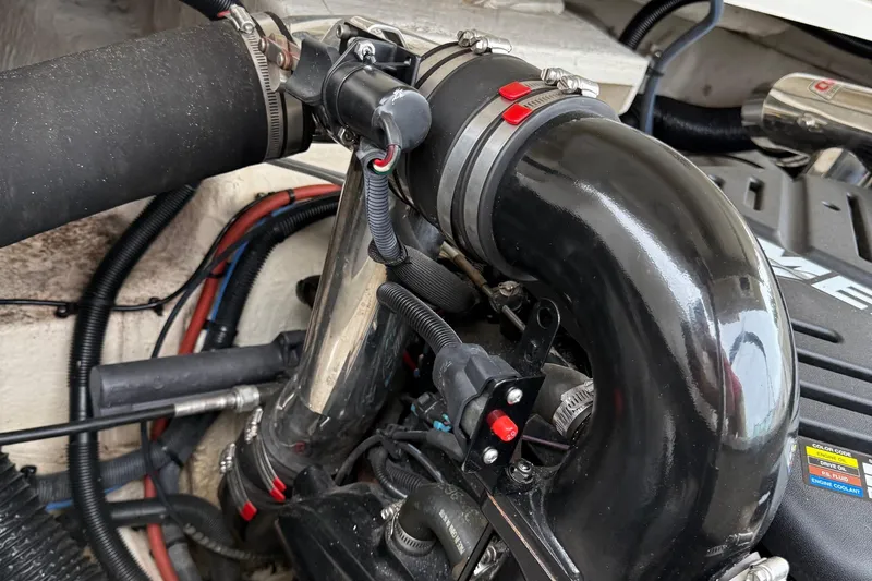 Slide: The Image of Engine compartment of a 2005 Sea Ray 270 SLX boat, showing hoses and components. - 10