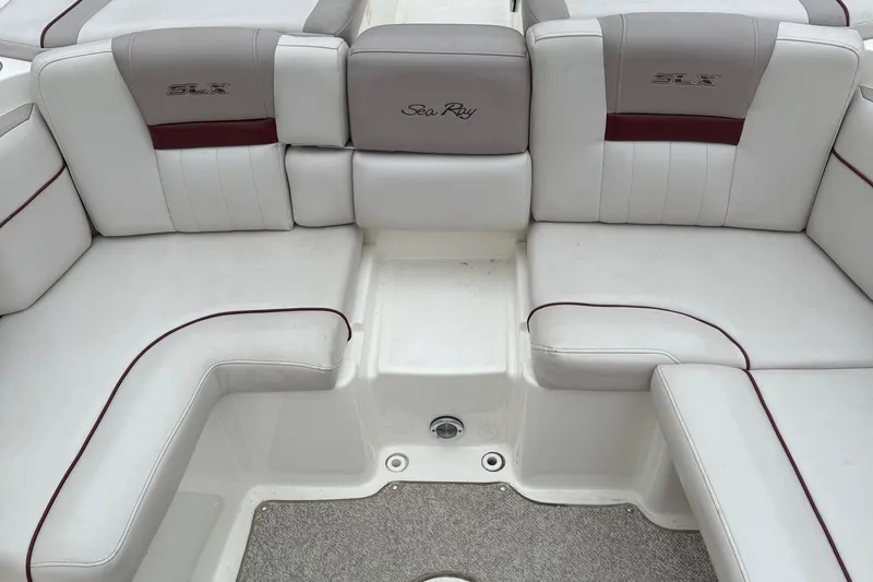 Slide: The Image of 2005 Sea Ray 270 SLX boat interior with white and gray seating. - 16