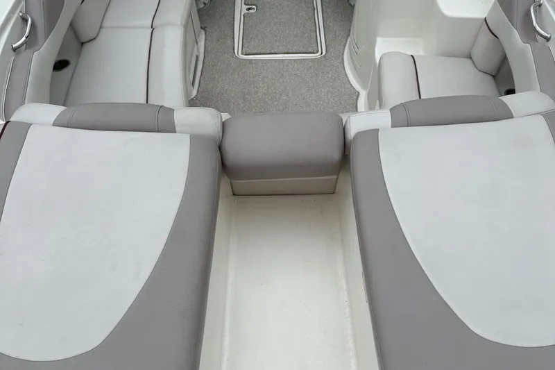 Slide: The Image of 2005 Sea Ray 270 SLX boat interior with gray and white seating. - 17