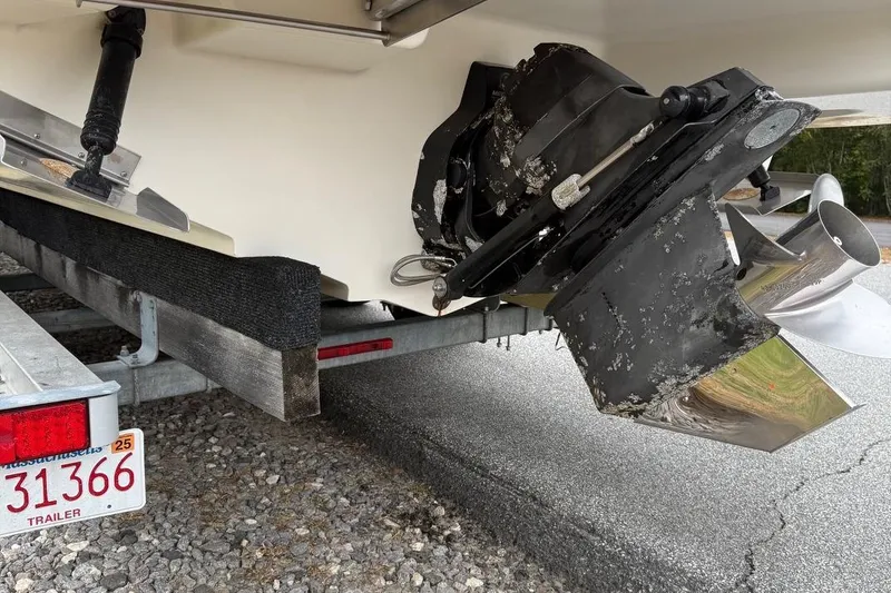 Slide: The Image of Rear view of a 2005 Sea Ray 270 SLX boat on a trailer, showing the propeller and outdrive. - 18