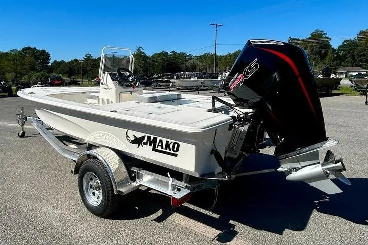 Slide: The Image of 2026 Mako 18 Pro Skiff boat on trailer, featuring powerful outboard motor. - 7