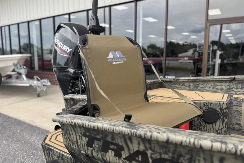 Slide: The Image of 2026 Tracker Grizzly 1650 T Prairie Wings Edition boat with Mercury engine and Millennium Marine seat. - 4