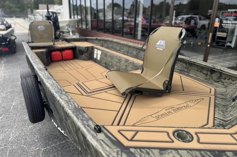 Slide: The Image of 2026 Tracker Grizzly 1650 T Prairie Wings Edition boat with camo design and comfortable seating. - 6
