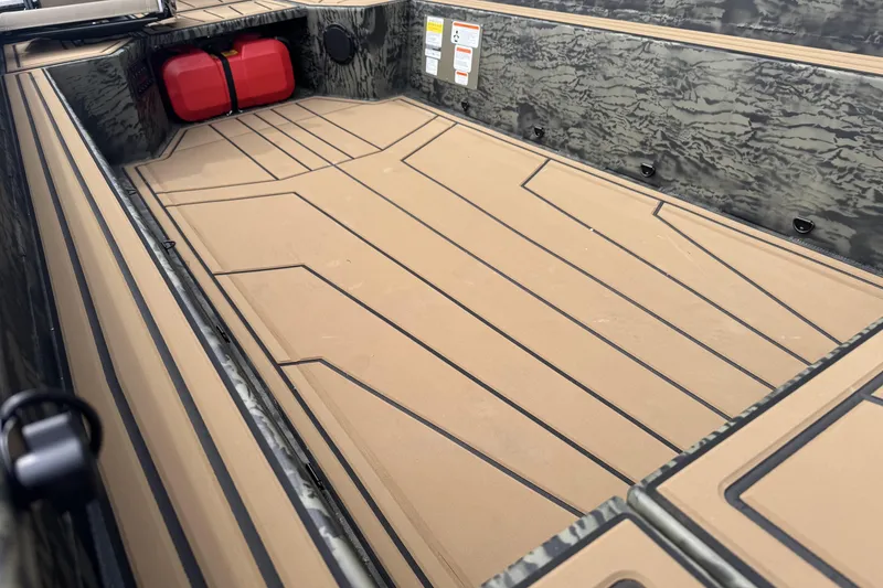 Slide: The Image of 2026 Tracker Grizzly 1650 T Prairie Wings Edition boat interior with camo design. - 7