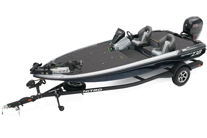 Slide: The Image of 2026 Nitro Z18 Pro boat on trailer, parked outdoors, featuring Garmin equipment. - 1