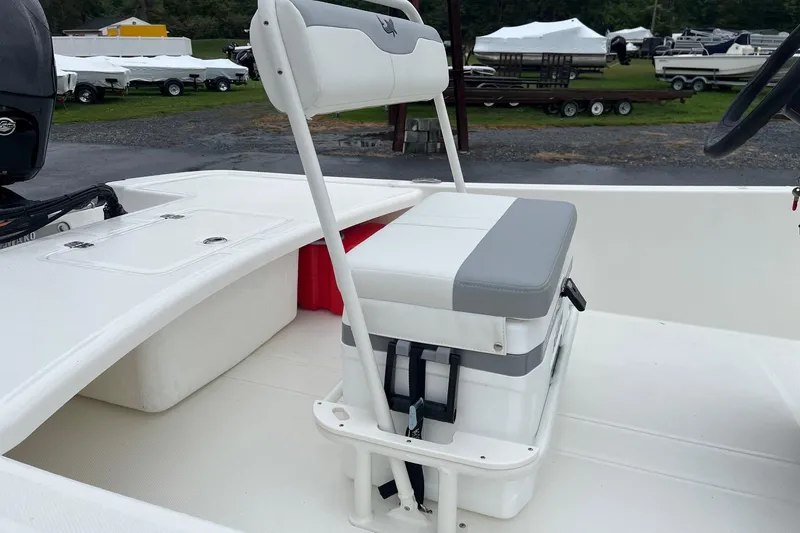 Slide: The Image of 2026 Mako Pro Skiff 17 CC boat interior with seating and storage. - 3
