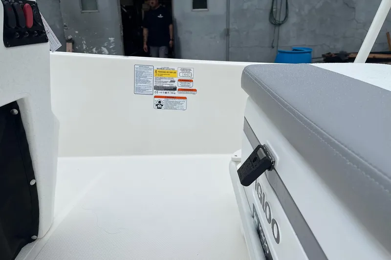 Slide: The Image of Interior view of 2026 Mako Pro Skiff 17 CC boat with seating and control panel. - 8