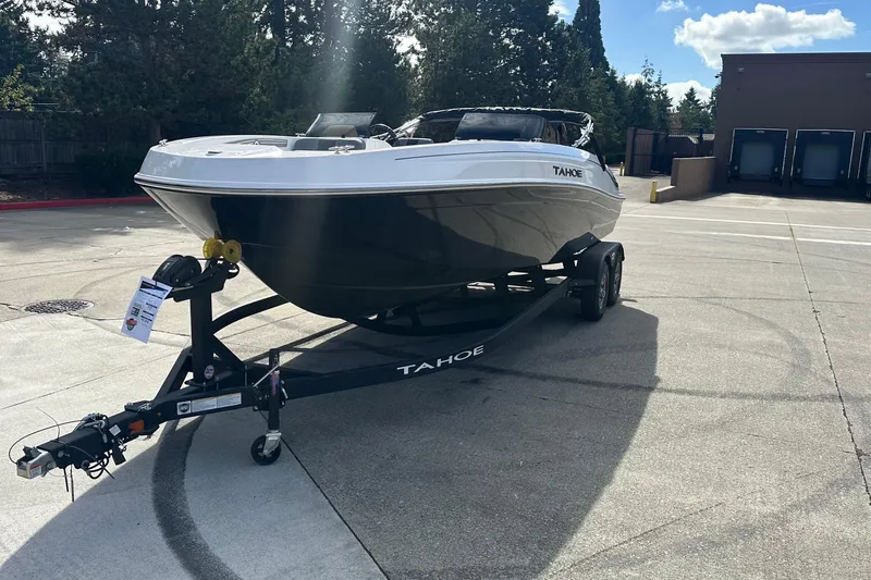 Slide: The Image of 2026 Tahoe T21 boat on trailer in sunny outdoor setting. - 3