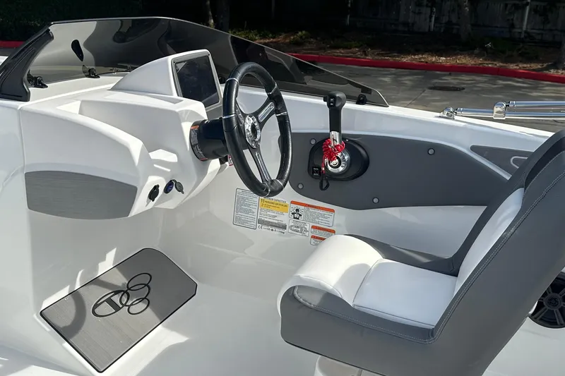 Slide: The Image of 2026 Tahoe T21 boat cockpit with steering wheel and control panel. - 6