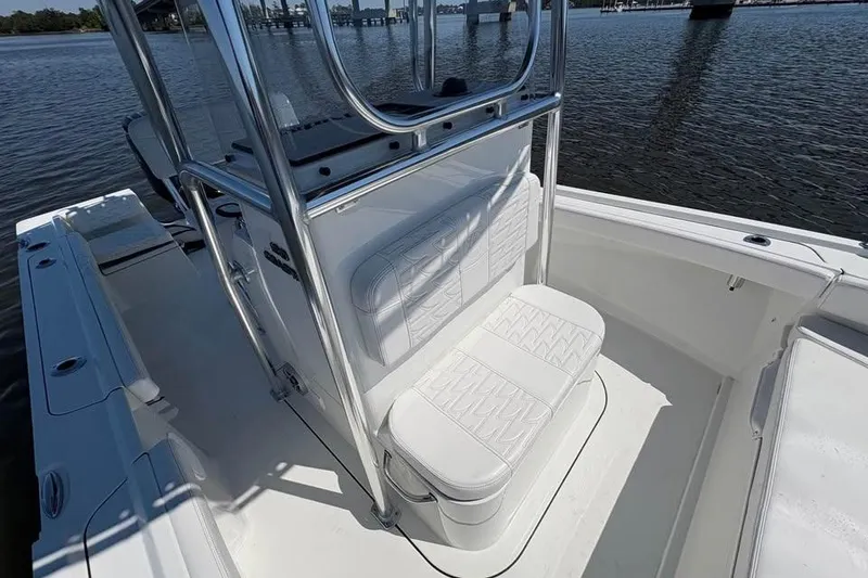 Slide: The Image of 2026 Parker 180 Coastal boat interior with white seating and stainless steel frame. - 11