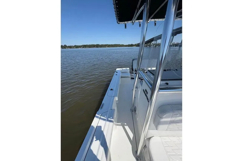 Slide: The Image of 2026 Parker 180 Coastal boat on calm water, featuring sleek design and spacious deck. - 12