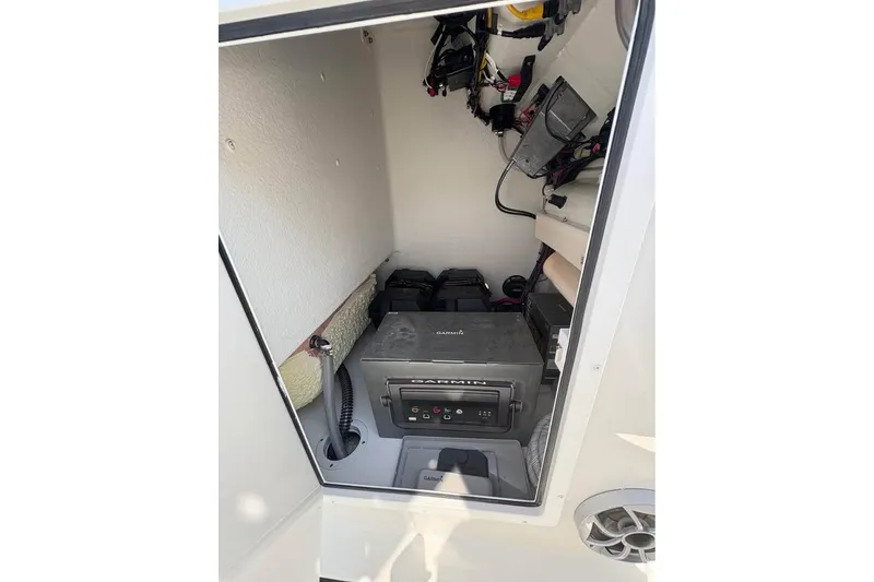 Slide: The Image of Interior view of 2026 Parker 180 Coastal boat compartment with Garmin equipment. - 19