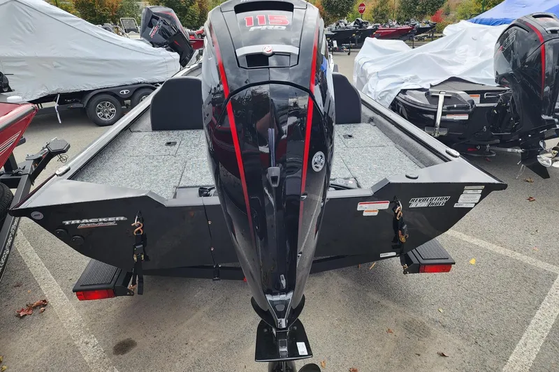 Slide: The Image of 2026 Tracker Pro Team 190 boat with powerful outboard motor in a parking lot. - 3