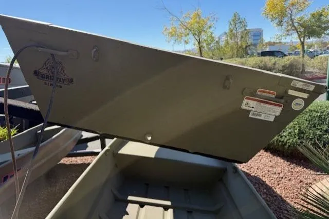 Slide: The Image of 2026 Tracker Grizzly 12 Jon boat in outdoor setting, showcasing its sturdy design. - 3