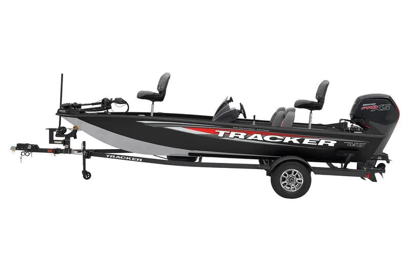 The Image of Red 2026 Tracker Pro Team 190 boat on trailer, parked outdoors. - 1