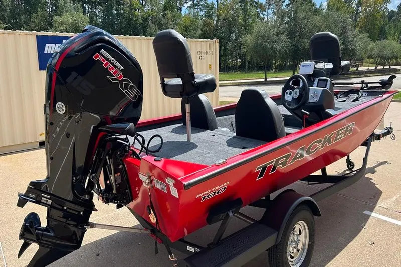 Slide: The Image of 2026 Tracker Pro Team 190 boat with Mercury Pro XS engine, parked outdoors. - 10