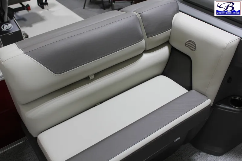 Slide: The Image of 2026 Sun Tracker Fishin' Barge 22 DLX, comfortable seating detail, gray and white upholstery. - 10