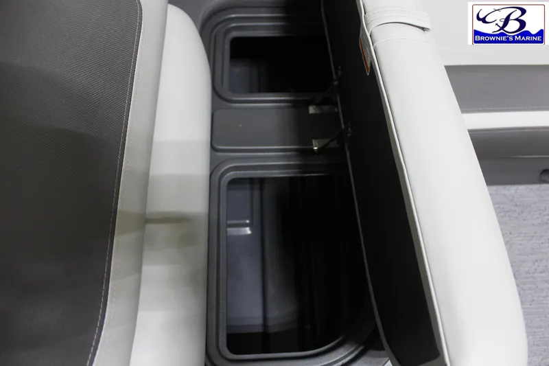 Slide: The Image of 2026 Sun Tracker Fishin' Barge 22 DLX storage compartments, featuring sleek seating design. - 16