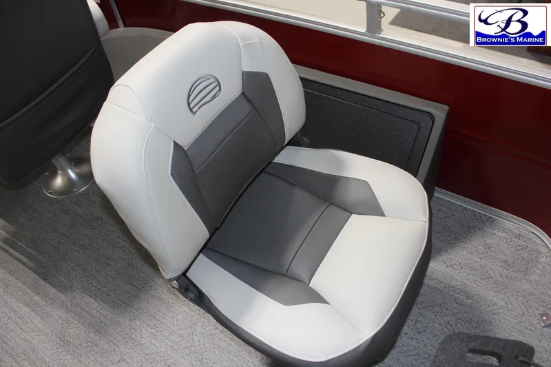 Slide: The Image of 2026 Sun Tracker Fishin' Barge 22 DLX boat seat, gray and white design, Brownie's Marine logo. - 22