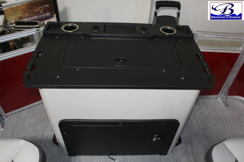 Slide: The Image of 2026 Sun Tracker Fishin' Barge 22 DLX console with cup holders and storage. - 24