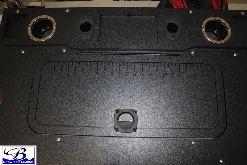 Slide: The Image of 2026 Sun Tracker Fishin' Barge 22 DLX deck with integrated measuring ruler. - 25