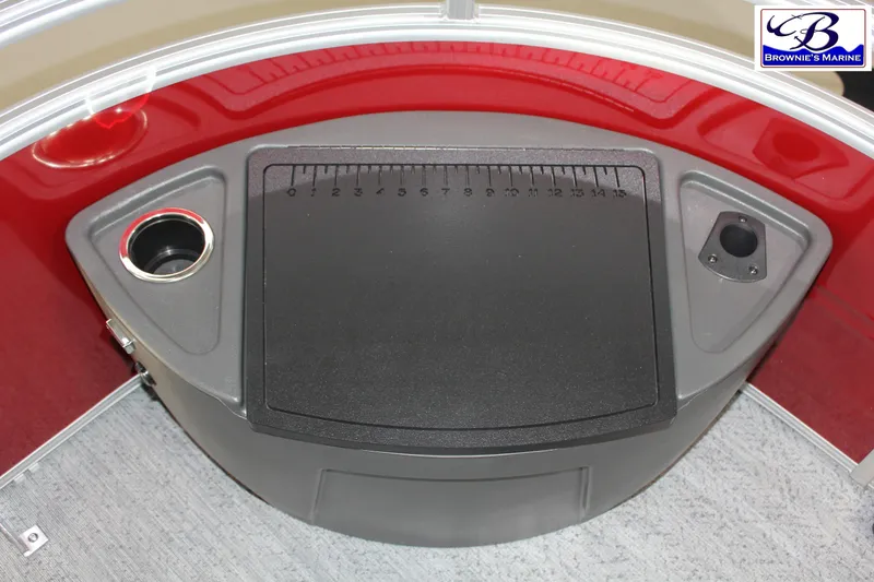 Slide: The Image of 2026 Sun Tracker Fishin' Barge 22 DLX fishing station with measuring board and cup holder. - 6