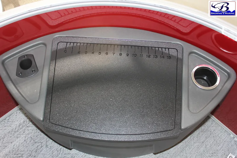 Slide: The Image of 2026 Sun Tracker Fishin' Barge 22 DLX dashboard with measurement panel and cup holder. - 8