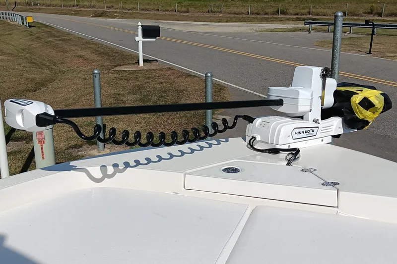 Slide: The Image of 2026 Ranger 2360 Bay boat with Minn Kota trolling motor on deck. - 14