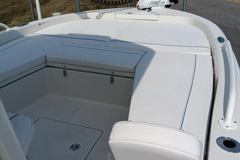 Slide: The Image of 2026 Ranger 2360 Bay boat interior with white cushioned seating. - 19