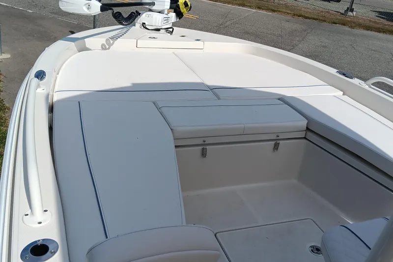 Slide: The Image of 2026 Ranger 2360 Bay boat interior with cushioned seating and storage compartments. - 20