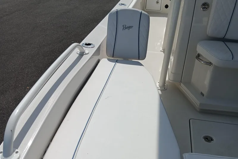 Slide: The Image of 2026 Ranger 2360 Bay boat interior with white seating and sleek design. - 21