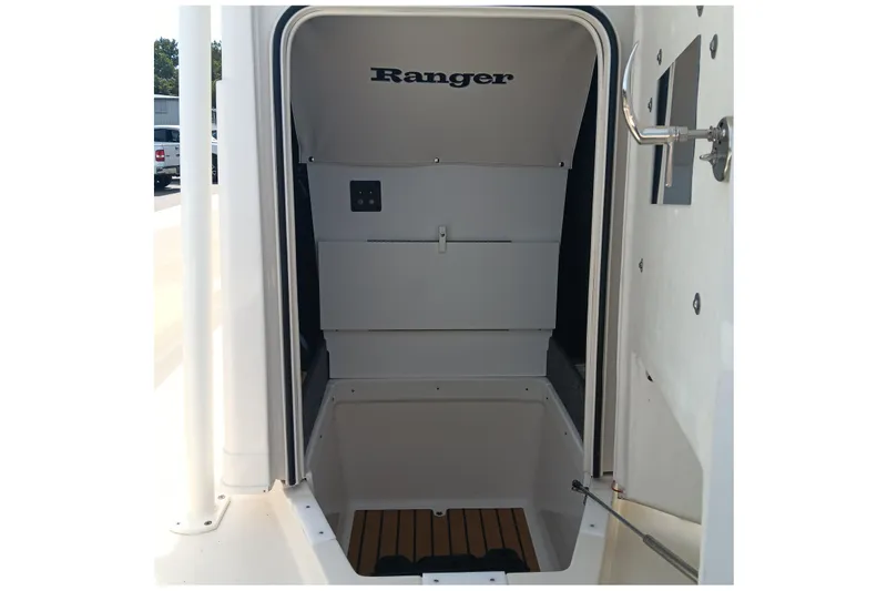 Slide: The Image of 2026 Ranger 2360 Bay boat interior storage compartment with wooden flooring. - 23