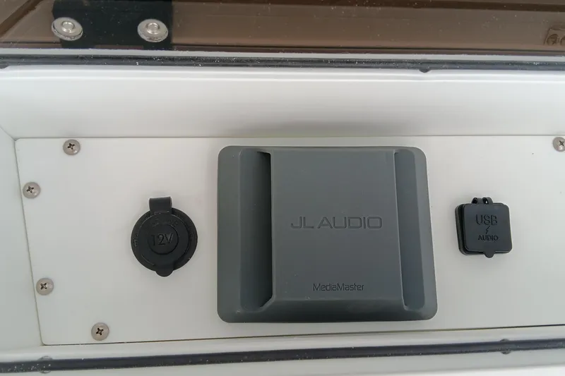 Slide: The Image of JL Audio MediaMaster panel with 12V and USB ports on 2026 Ranger 2360 Bay. - 28