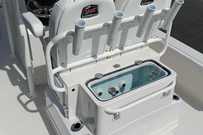 Slide: The Image of 2026 Ranger 2360 Bay boat interior with rod holders and livewell. - 29