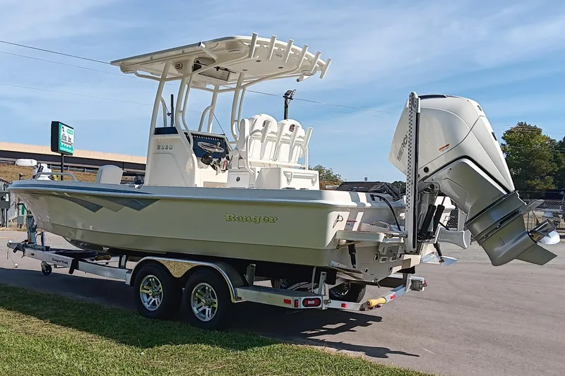 Slide: The Image of 2026 Ranger 2360 Bay boat on trailer with powerful outboard motor. - 5