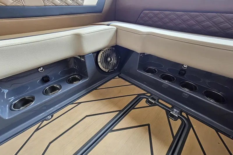 Slide: The Image of 2024 Varatti Z2272 interior with cup holders and speaker, featuring quilted upholstery. - 5