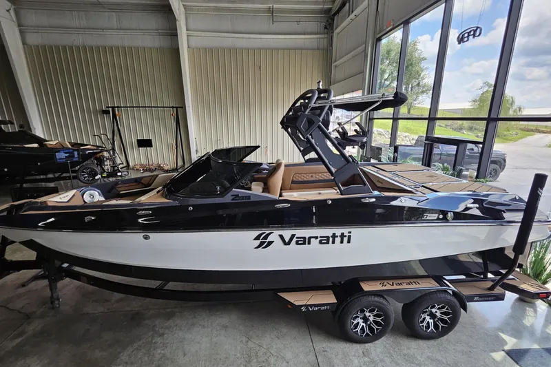 Slide: The Image of 2024 Varatti Z2272 boat in showroom, sleek design with black and white finish. - 7