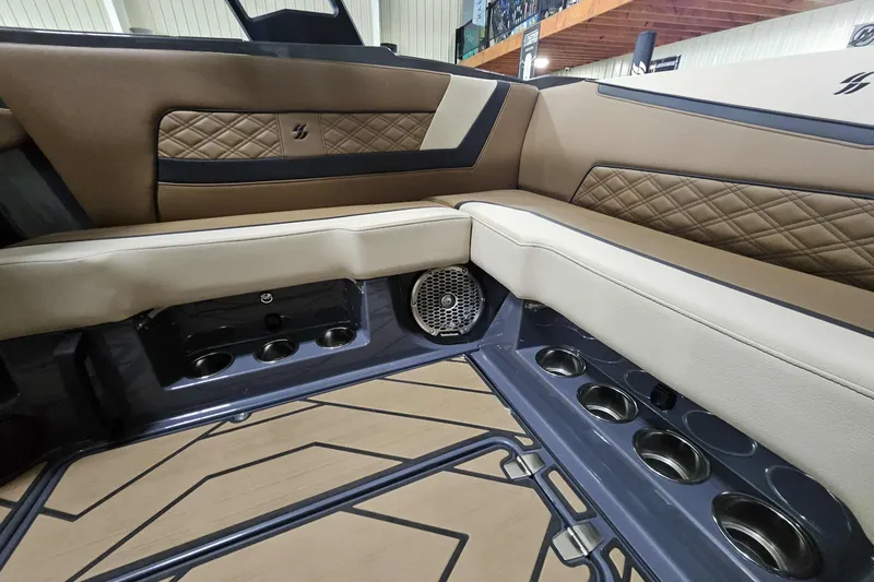 Slide: The Image of Luxurious interior of 2024 Varatti Z2272 boat with tan leather seating and cup holders. - 9