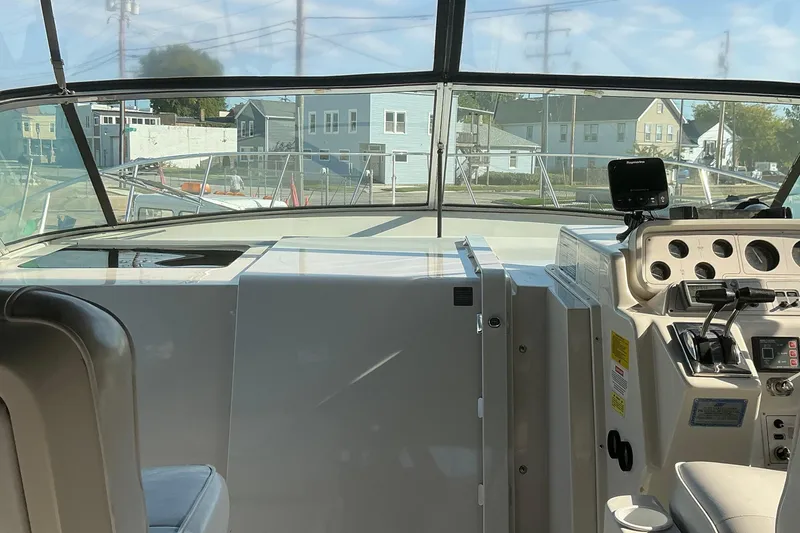 Slide: The Image of Interior view of 1992 Wellcraft 3400 Gran Sport boat cockpit with control panel. - 12