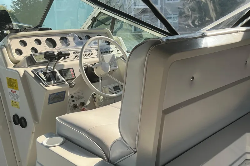 Slide: The Image of Interior cockpit of 1992 Wellcraft 3400 Gran Sport boat with steering wheel and controls. - 14