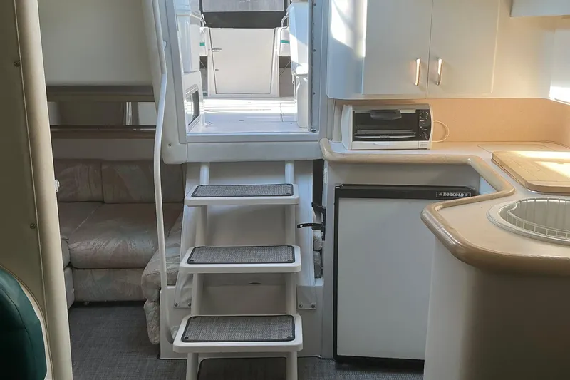 Slide: The Image of Interior of 1992 Wellcraft 3400 Gran Sport yacht with kitchenette and seating area. - 19