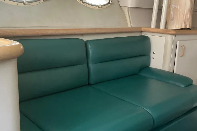 Slide: The Image of Interior of 1992 Wellcraft 3400 Gran Sport with green leather seating. - 26