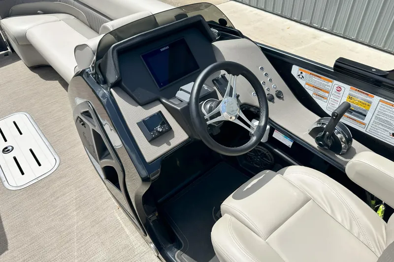 Slide: The Image of Interior view of 2021 Premier 250 Solaris RE boat cockpit with steering wheel and controls. - 9