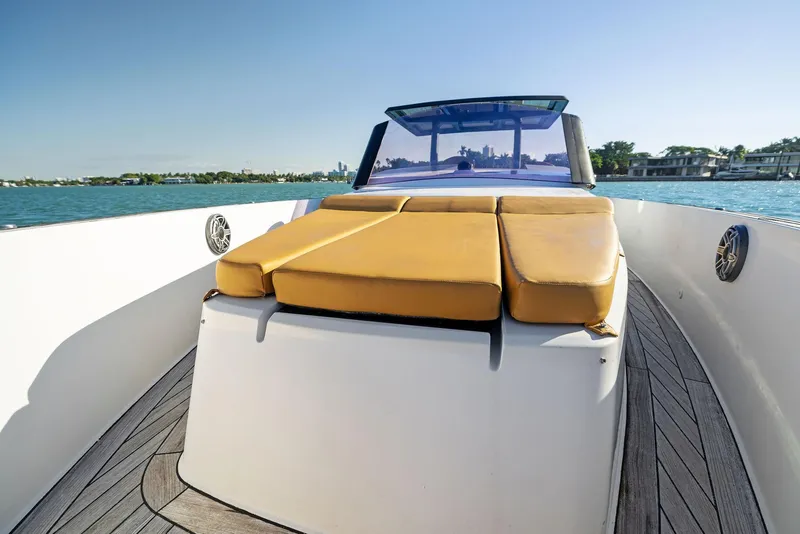 Slide: The Image of 2011 Fjord 40 Open yacht with sunbed, sleek design, and scenic water view. - 13