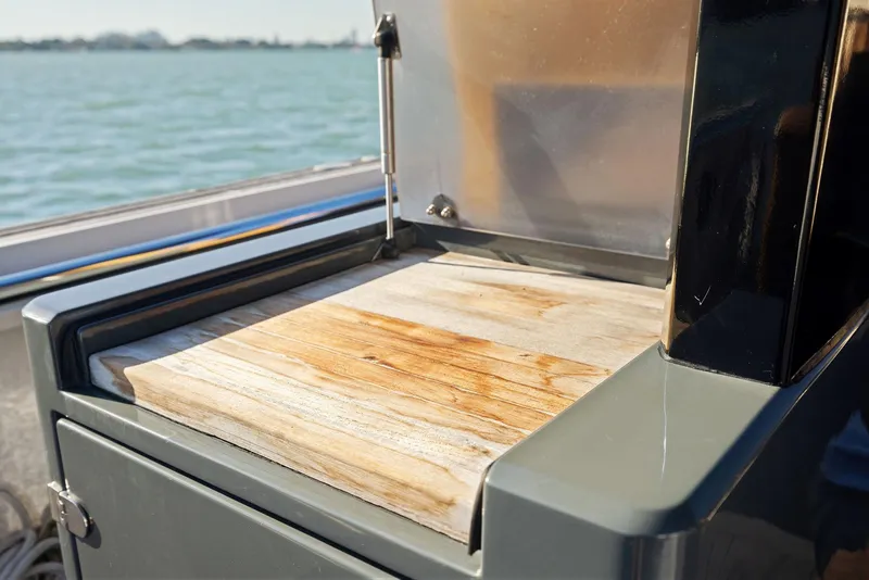 Slide: The Image of Cutting board on 2011 Fjord 40 Open yacht, with ocean view in the background. - 18