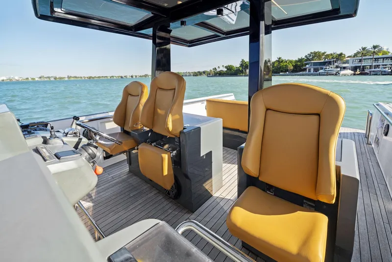 Slide: The Image of Interior of 2011 Fjord 40 Open yacht with tan seats and ocean view. - 29