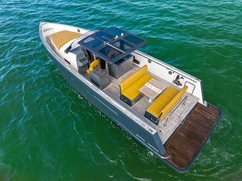 Slide: The Image of 2011 Fjord 40 Open boat on clear water, featuring sleek design and spacious seating. - 3