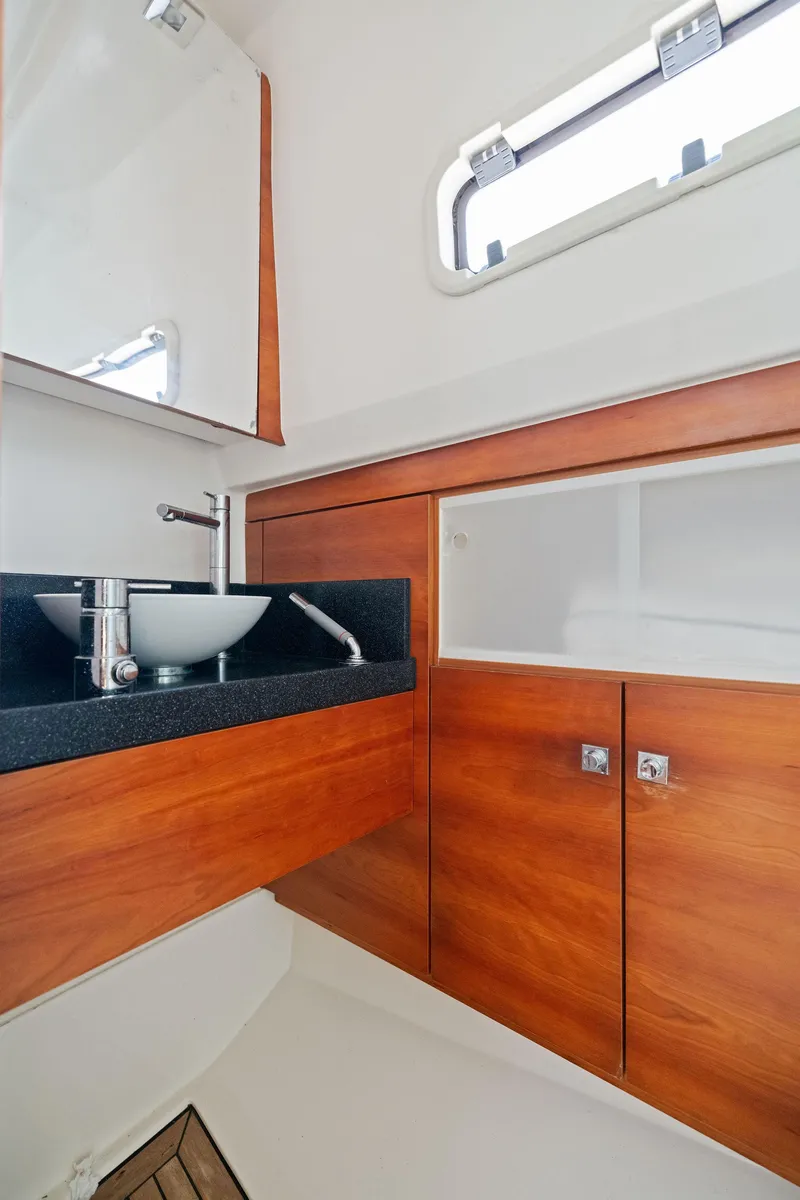 Slide: The Image of Modern bathroom interior of 2011 Fjord 40 Open yacht with wood cabinetry and sleek fixtures. - 45