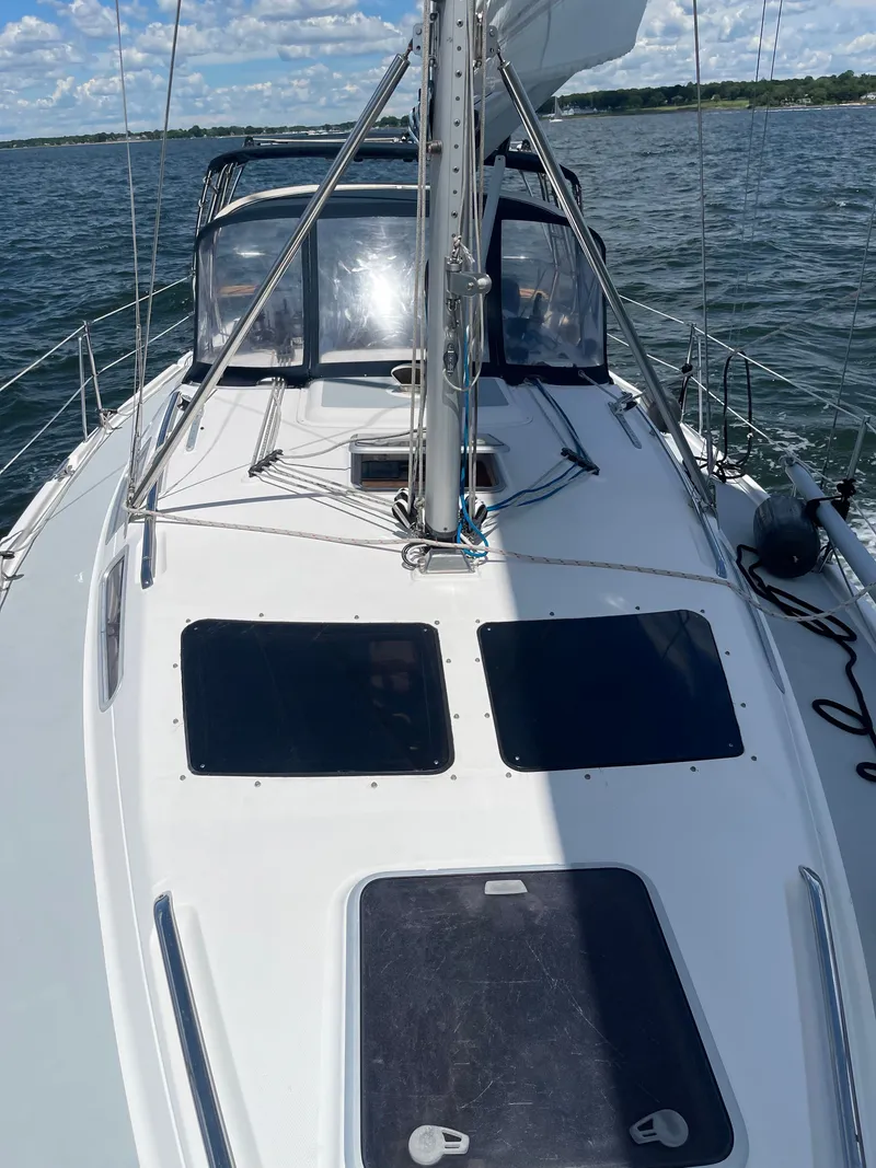 Slide: The Image of 2003 Hunter 356 sailboat on the water. - 39